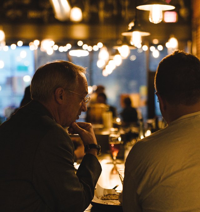 Two men talking at Brazen Open Kitchen and Bar